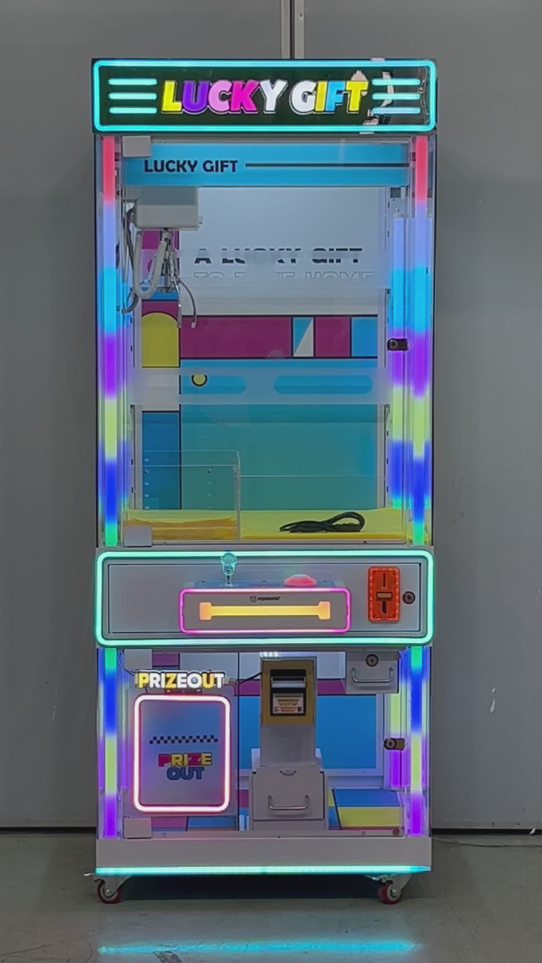 Máquina cazapeluches Lucky Gift azul: vistas del gabinete, controles y mecanismo.