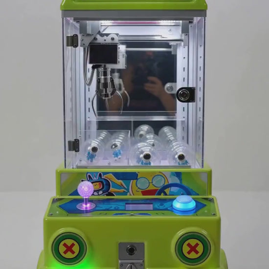 Máquina Speed Elf de clips verde: vistas del gabinete y funcionamiento.